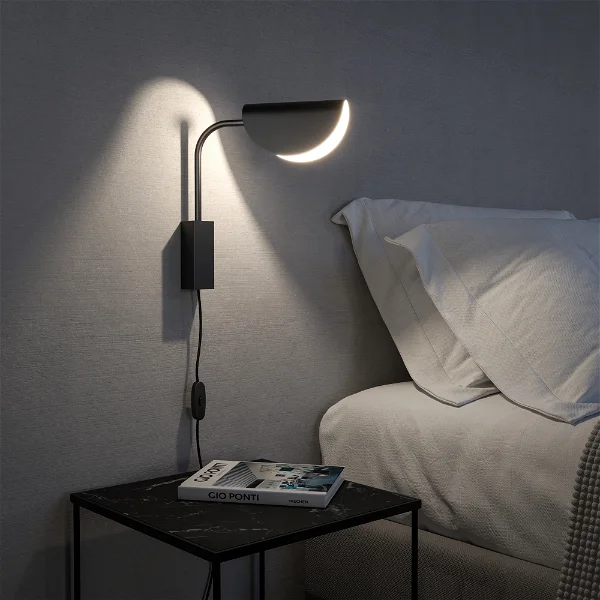 Eine schwarze Wandleuchte im Schlafzimmer